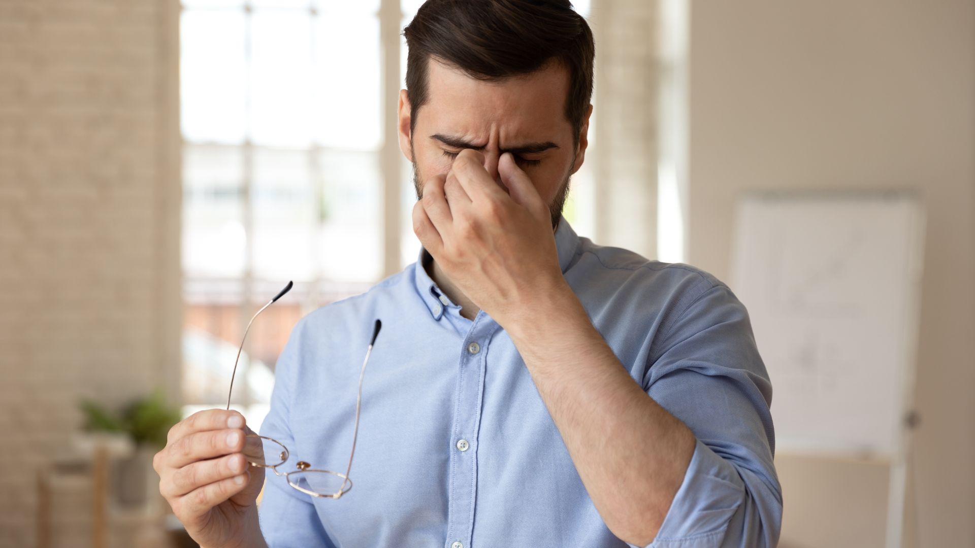 man having dry eye discomfort